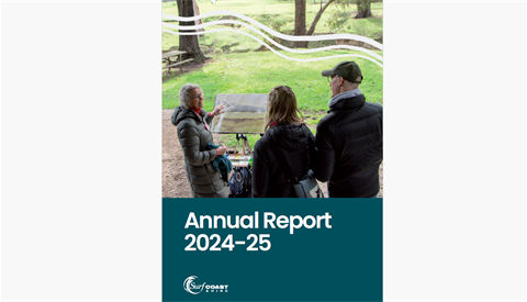 Cover of the Annual report 24-25 with an artist talking to some guests at her easel