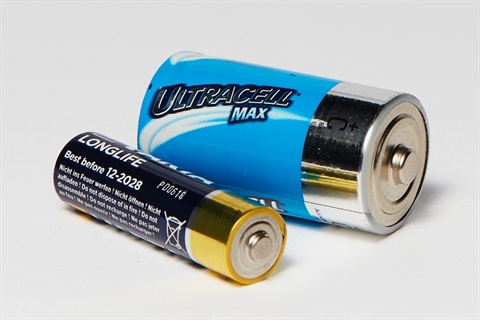 two batteries with a white background