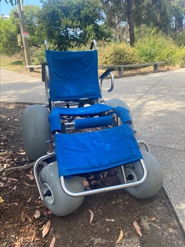 Sandcruiser Beach Wheelchair parked on the footpath