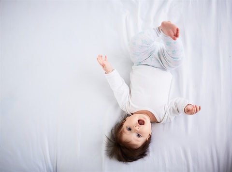 upside-down-baby-lies-bed