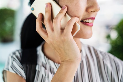 close up of woman on phone