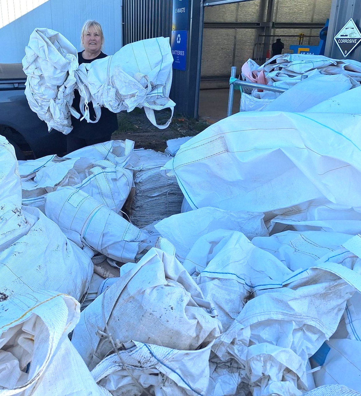 A pile of feed bags dropped off for recycling
